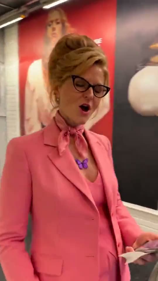 Phone on the train AI: a woman in a pink suit sticks her phone on a Paris metro train, chases it, and the phone rides on to the Eiffel Tower at night